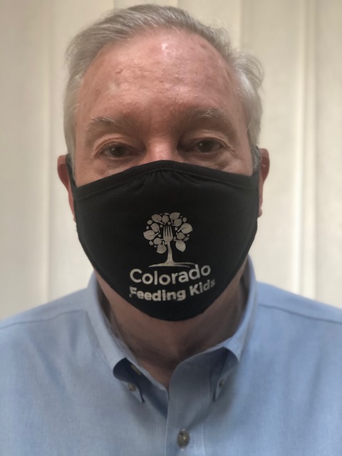 president of Colorado Feeding Kids wearing a branded face mask