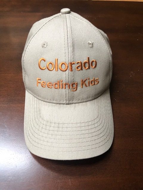 A beige ball cap hat with the words Colorado Feeding Kids on it